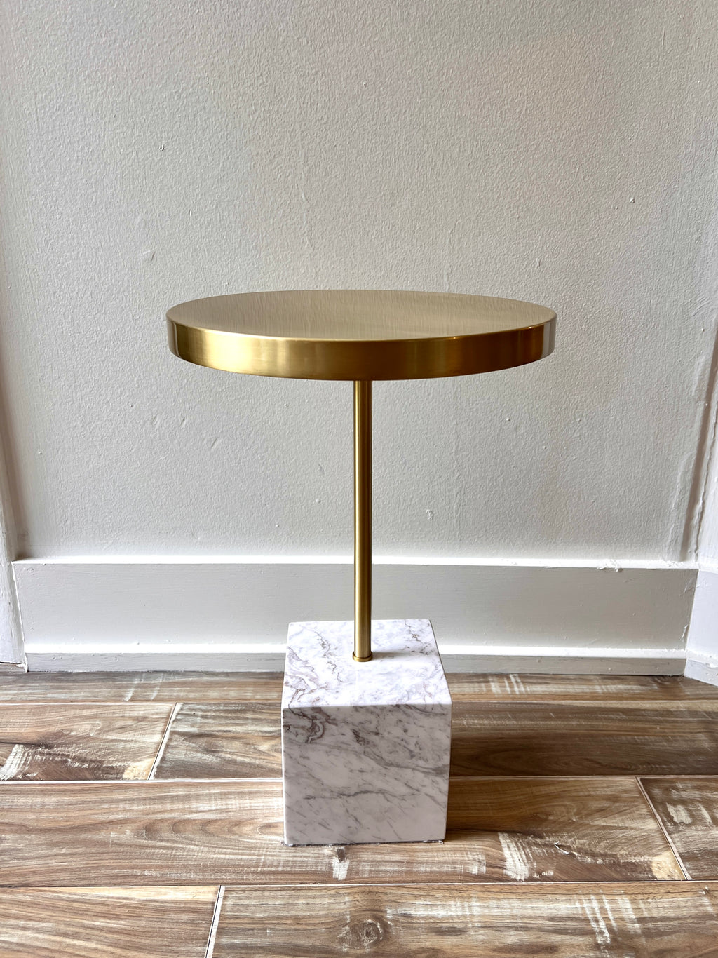 Contemporary white marble and brass top side table.