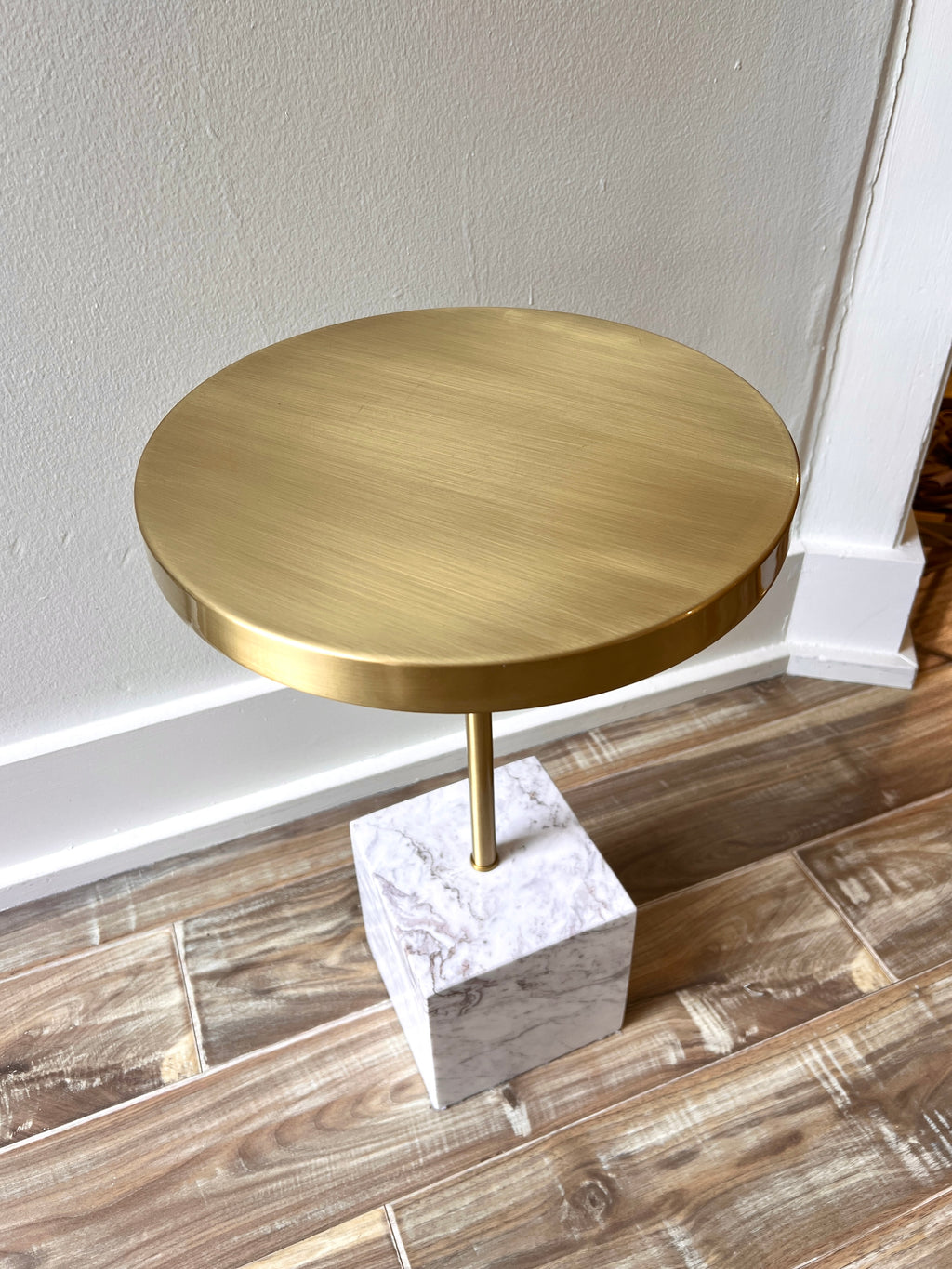 Contemporary white marble and brass top side table.