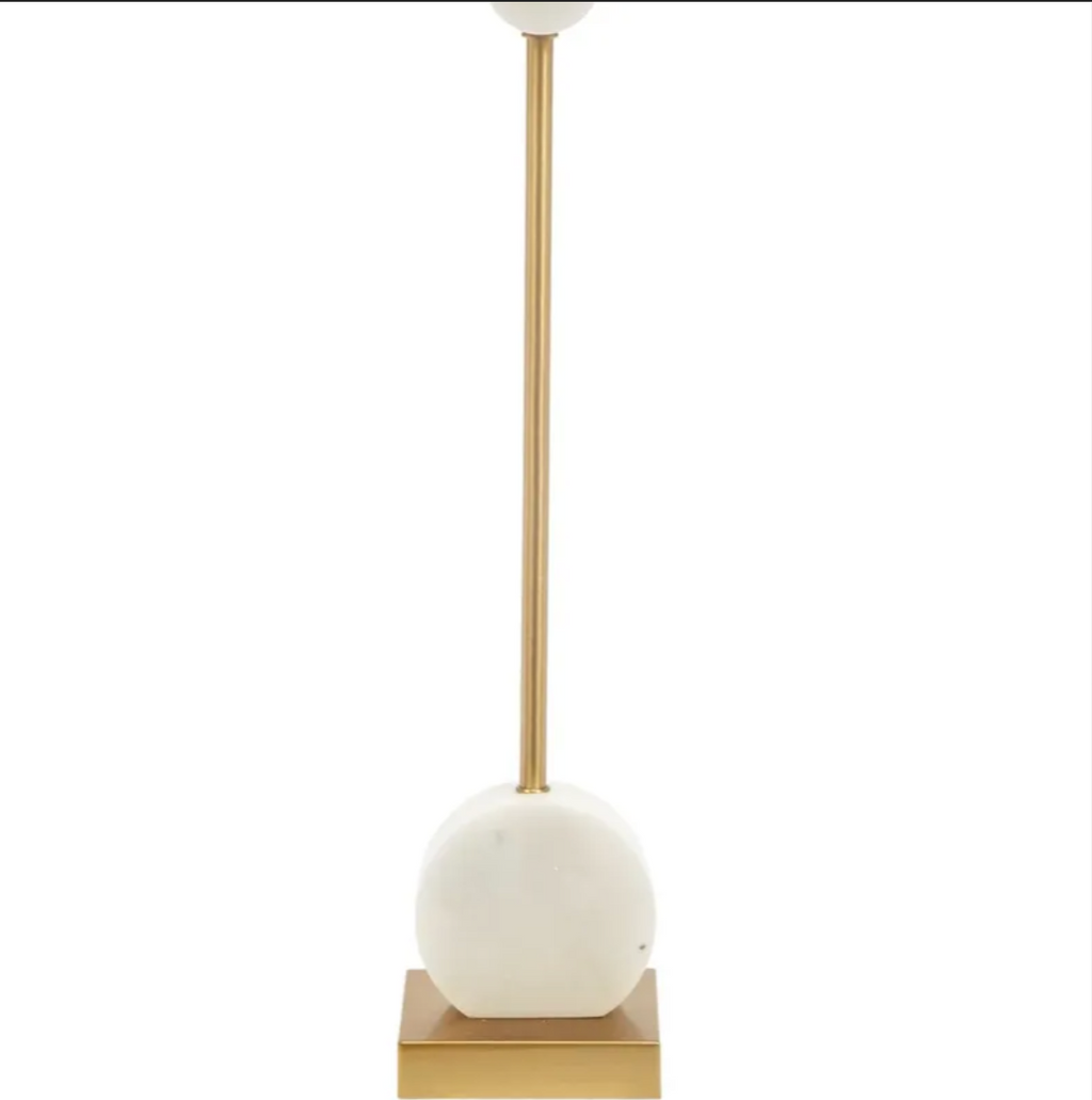 Slender gold table lamp with white alabaster accents and a white drum lampshade