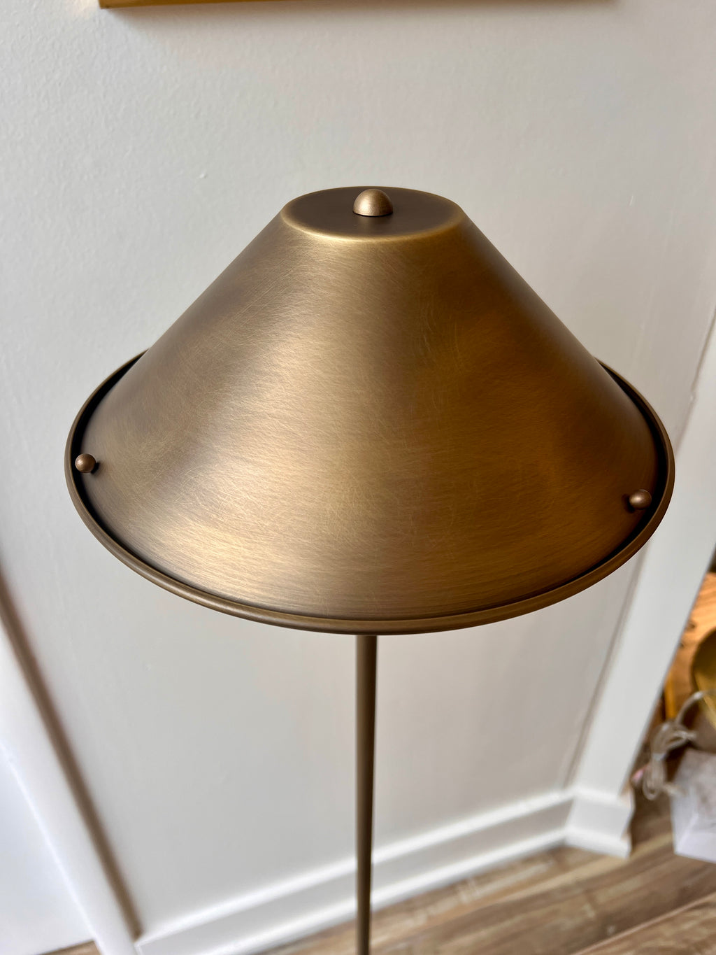 Close up of an Anna Lari cordless floor lamp in antique brushed brass