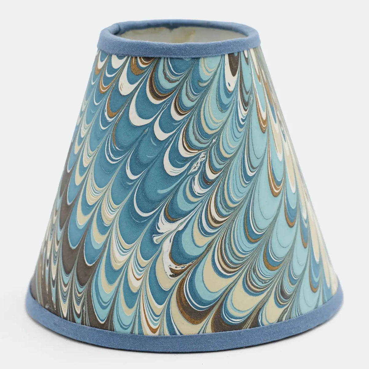 Hand marbled paper sconce lampshade in shades of aqua, brown, caramel, and cream with blue trim