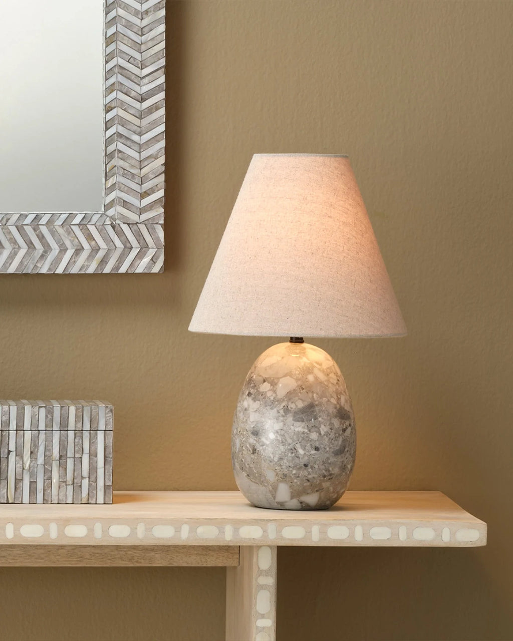 Grey travertine stone table lamp with a sculptural shape