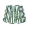 International Blue and Green McKenna Lampshade featuring a geometric Greek key pattern in blue, green, and ivory, finely pleated fabric, coordinating patterned trim, and a classic tapered silhouette.