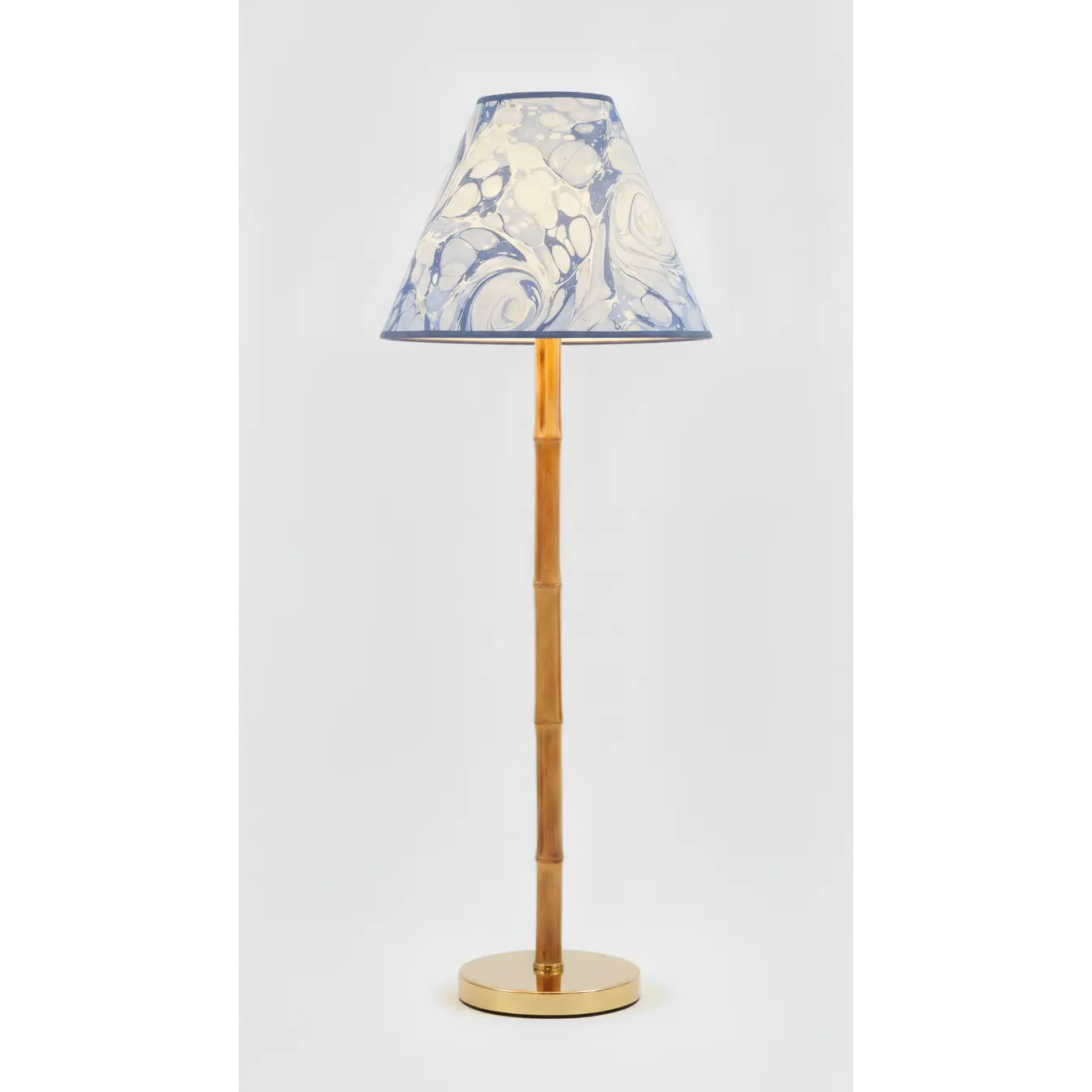 Ocean Marbled Empire Lampshade in blue tones styled on a wood table lamp in Nashville, Tennessee