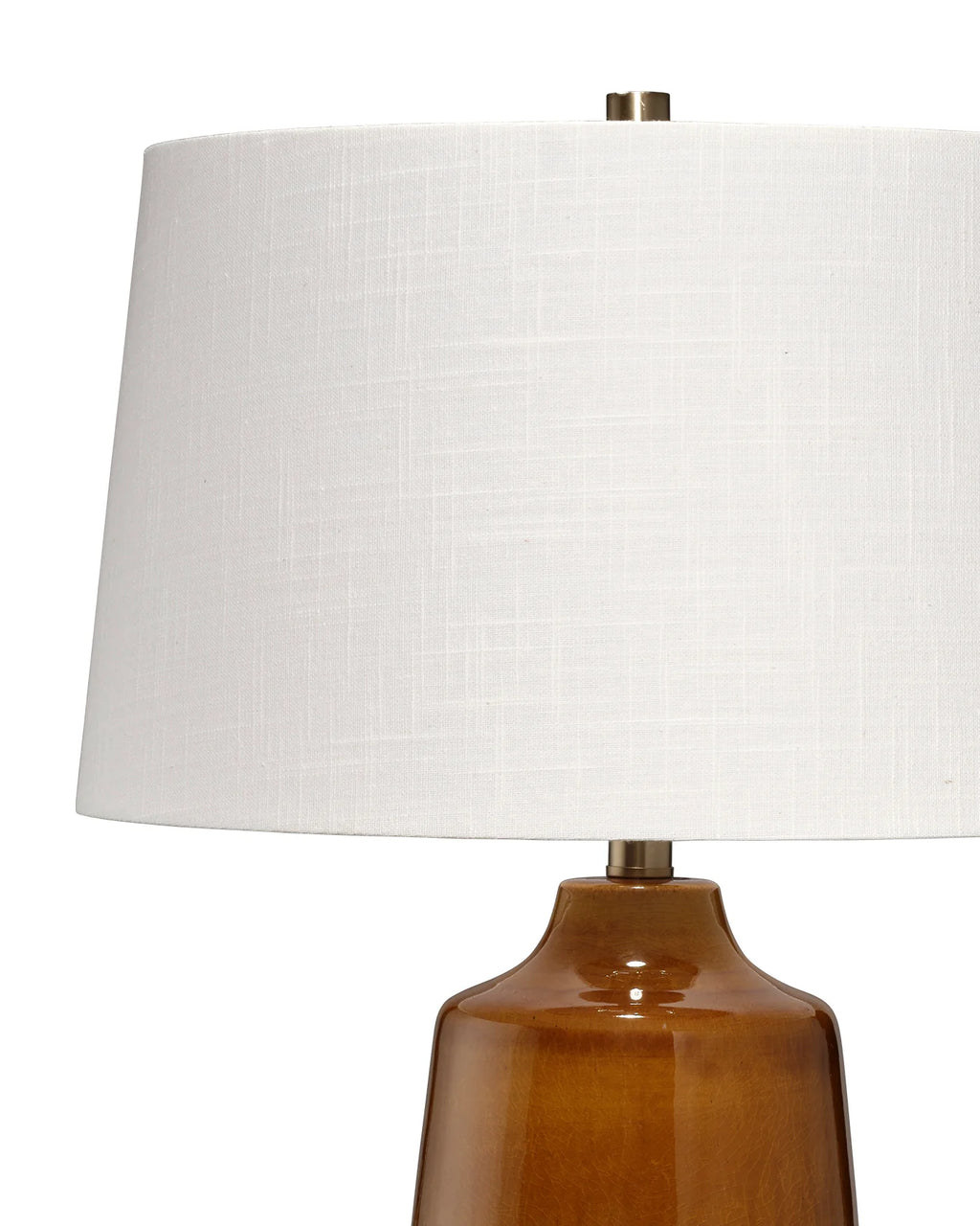 Lamp with a white linen shade and rich brown glazed base 