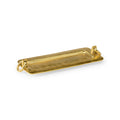 Cleo Gold Tray featuring an elongated rectangular silhouette, textured antique gold finish, raised edges, and sculptural ring handles at each end, displayed on a white background.