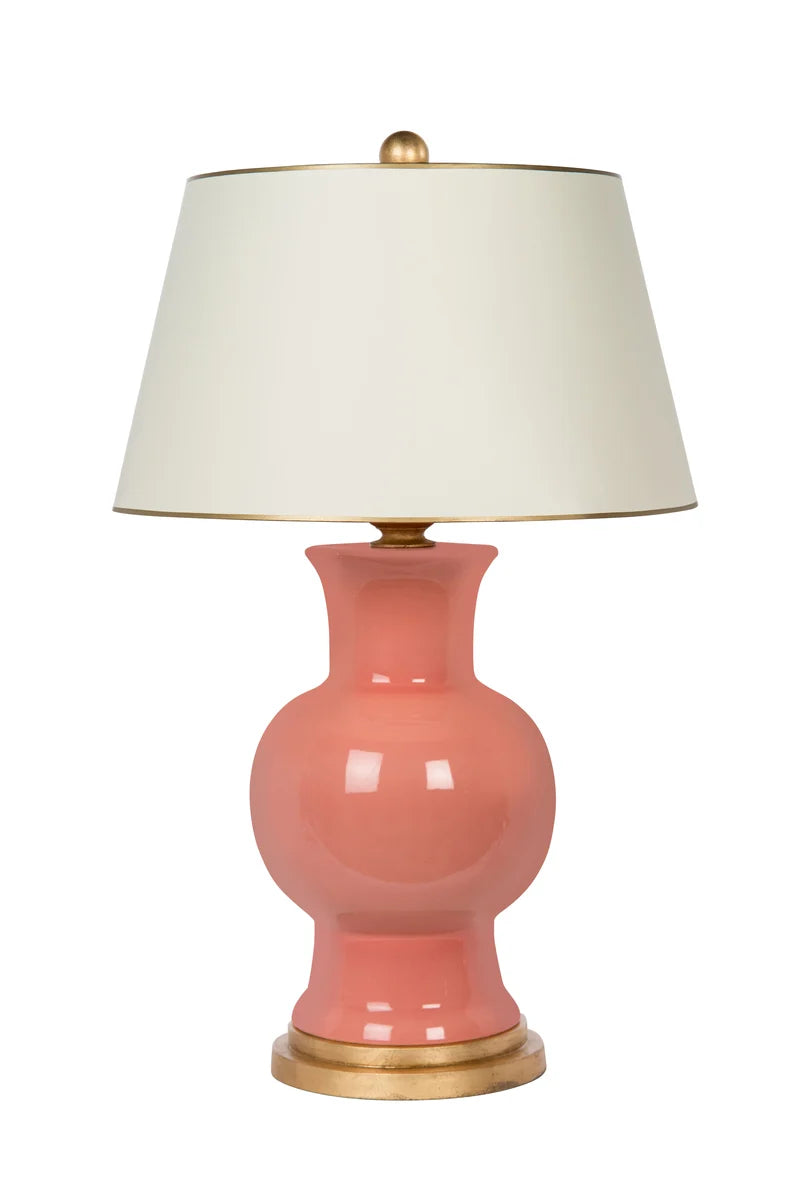 Coral ceramic table lamp with gold base and whtie lampshade with gold trim
