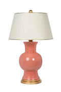 Coral ceramic table lamp with gold base and whtie lampshade with gold trim