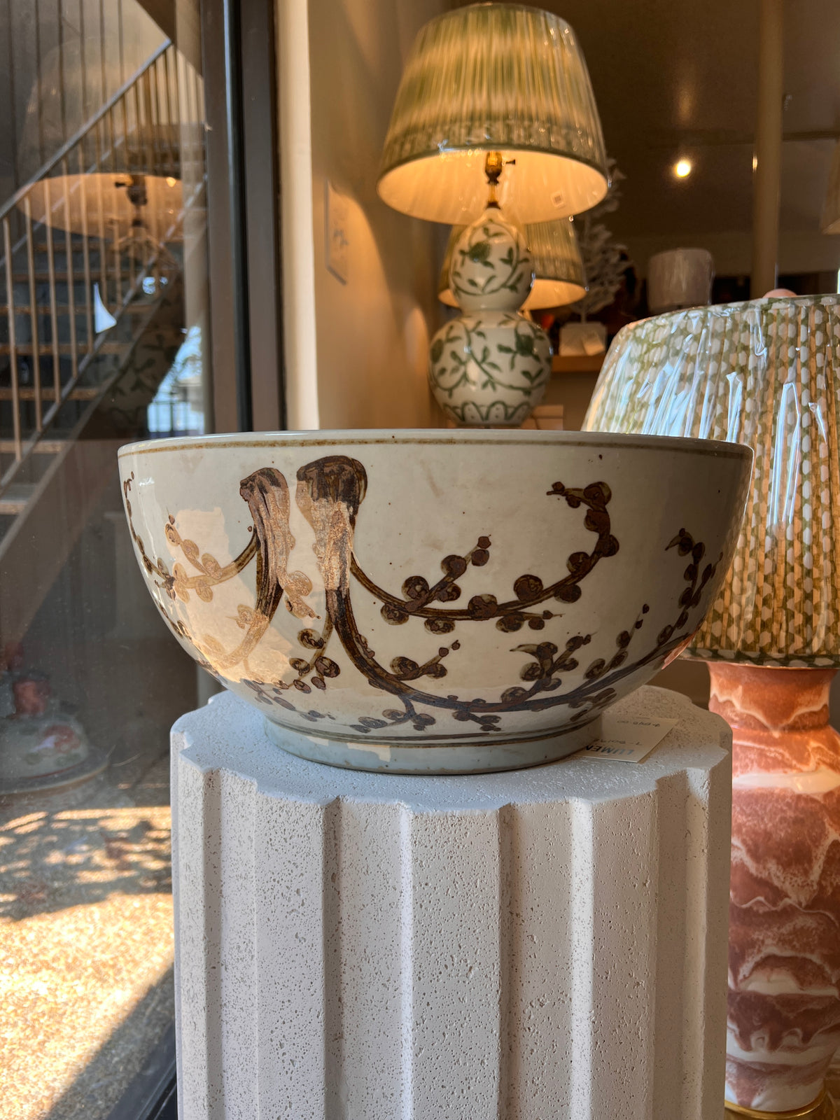 Cream and brown ceramic decorative bowl with Asian inspired branch and blossom motif 