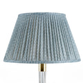 Fermoie Blue Figured empire lampshade styled on a glass table lamp in Nashville, Tennessee