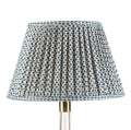 Fermoie Blue Marden Empire lampshade styled on a glass table lamp in Nashville, Tennessee
