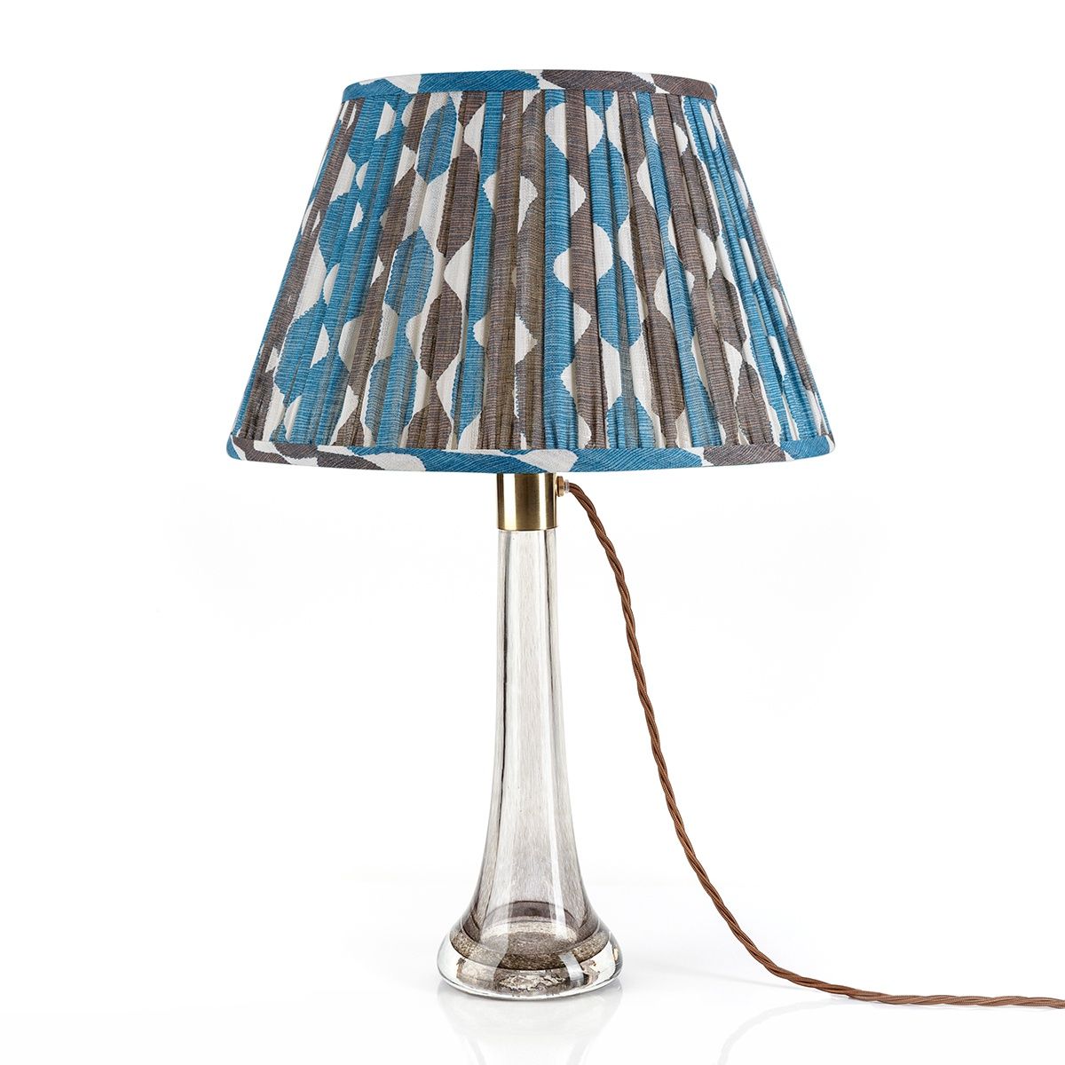Fermoie Blue and Neutral Whittle Empire lampshade styled on a lucite table lamp in Nashville, Tennessee