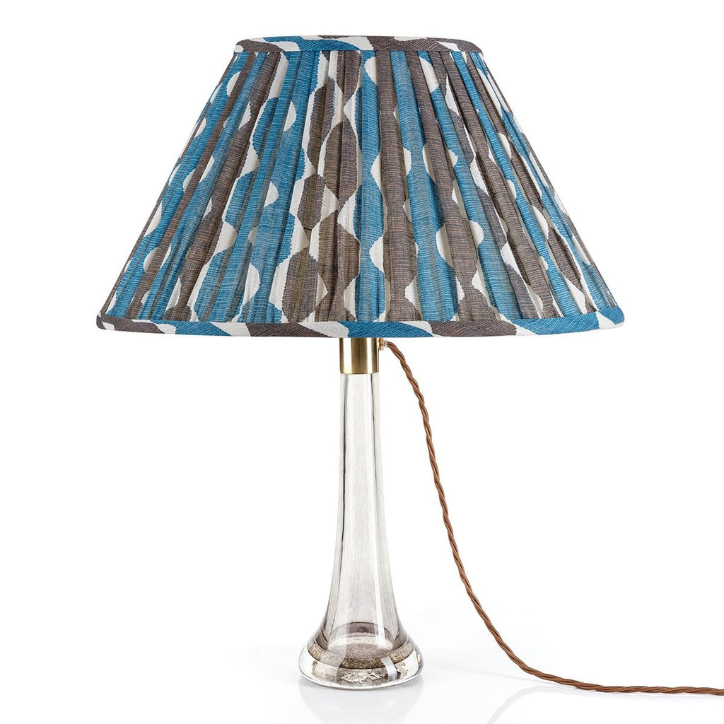 Fermoie Blue and Neutral Whittle oval lampshade styled on a glass table lamp in Nashville, Tennessee