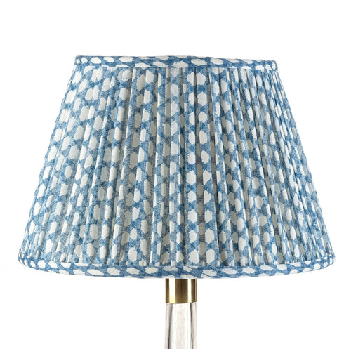 Fermoie Blue Wicker Empire lampshade styled on a glass table lamp in Nashville, Tennessee