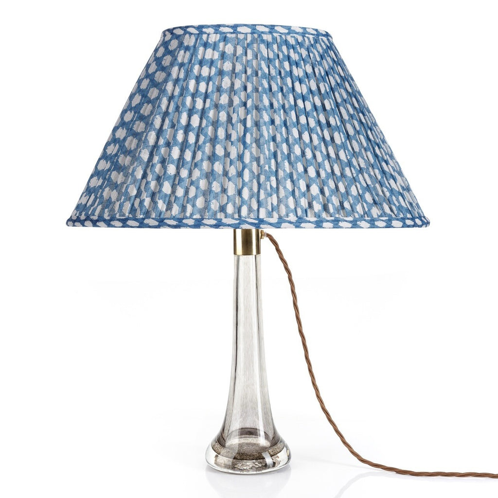 Fermoie Blue Wicker oval lampshade styled on a glass table lamp in Nashville, Tennessee