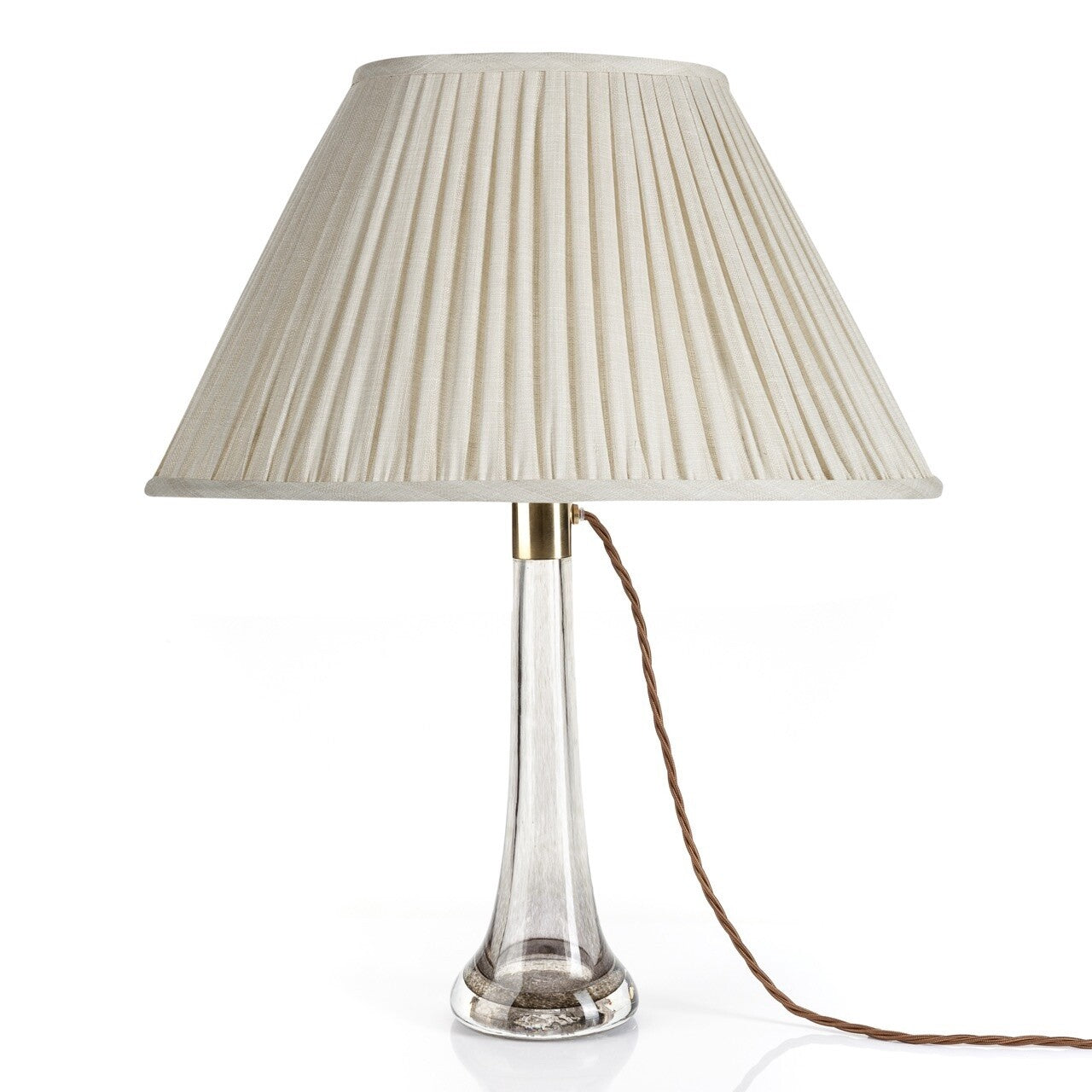 Fermoie Cream Moire oval lampshade styled on a glass table lamp in Nashville, Tennessee