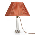 Fermoie Fresco oval lampshade styled on a glass table lamp in Nashville, Tennessee