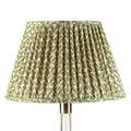Fermoie Green Rabanna empire lampshade styled on a glass table lamp in Nashville, Tennessee