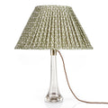 Fermoie Green Rabanna oval lampshade styled on a glass table lamp in Nashville, Tennessee