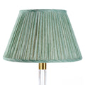 Fermoie Green Strié empire lampshade styled on a glass table lamp in Nashville, TN