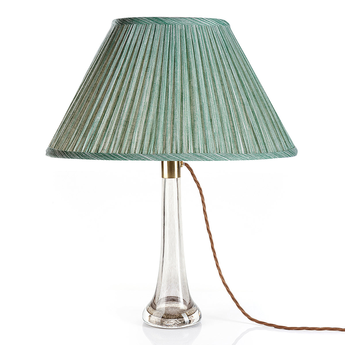 Fermoie Green Strié oval lampshade styled on a glass table lamp in Nashville, Tennessee