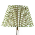 Fermoie Green Wicker empire lampshade styled on a glass table lamp in Nashville, Tennessee