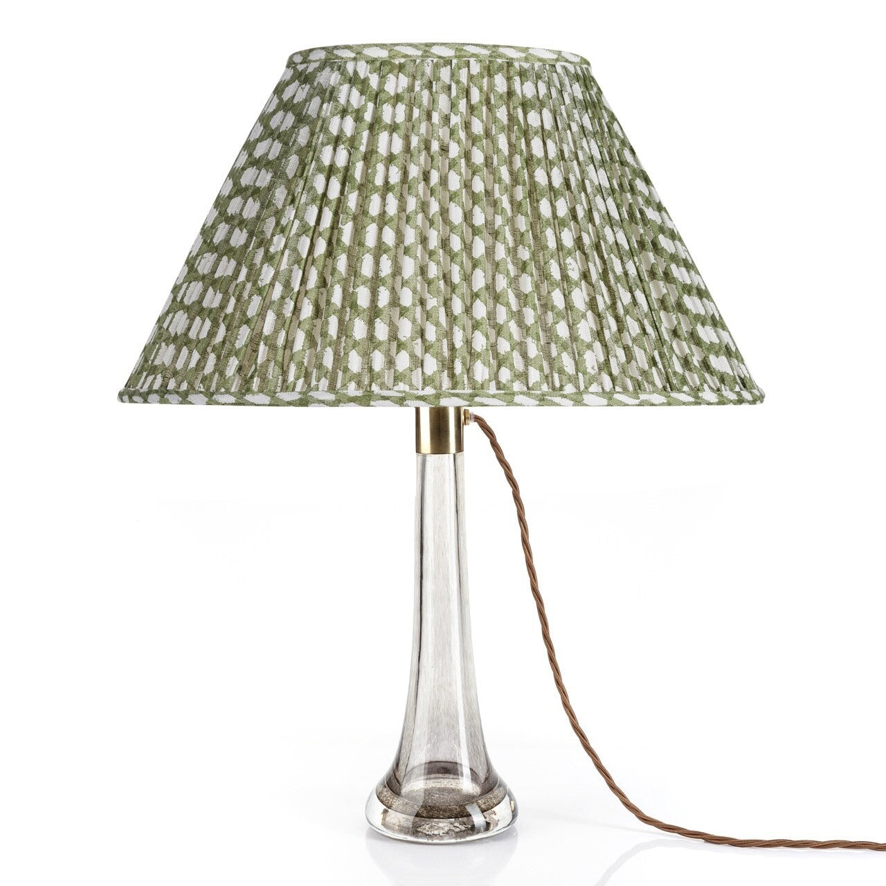 Fermoie Green Wicker oval lampshade styled on a glass table lamp in Nashville, Tennessee