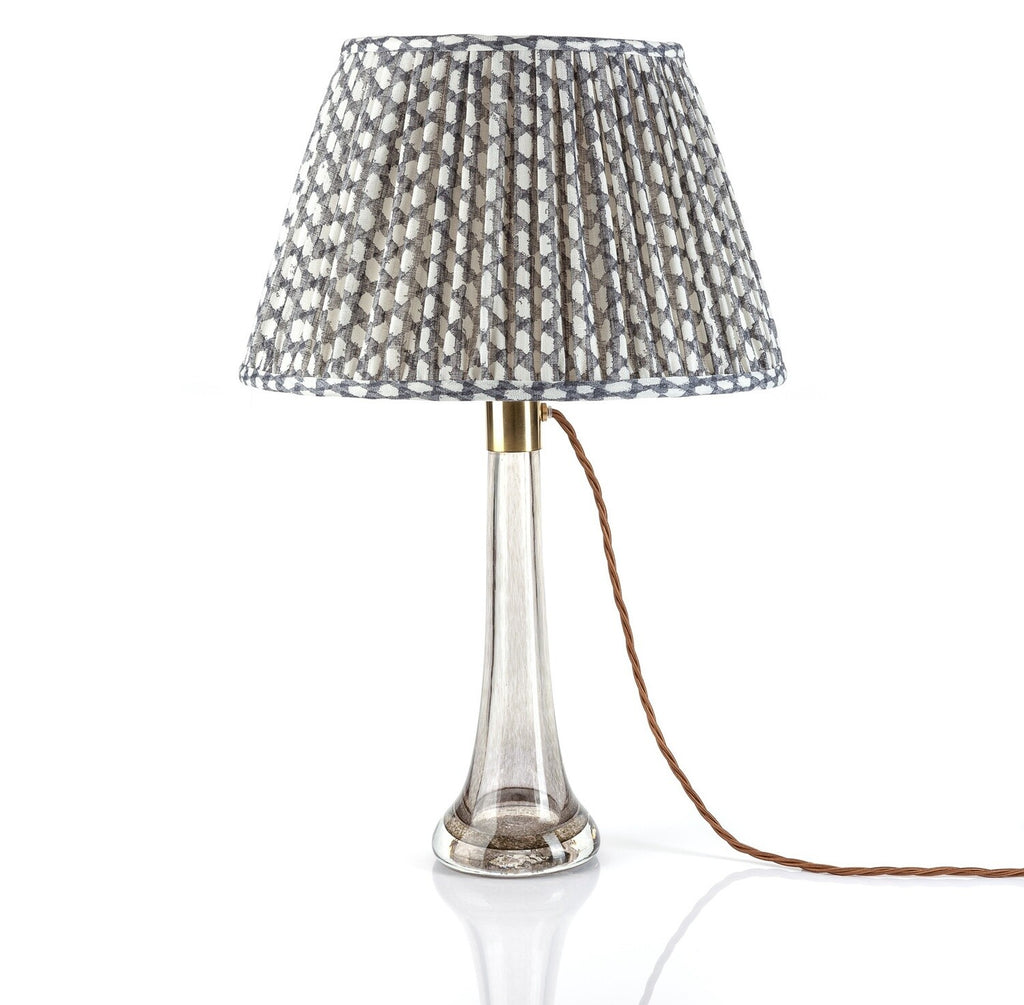 Fermoie Grey Wicker empire lampshade styled on a glass table lamp in Nashville, Tennessee