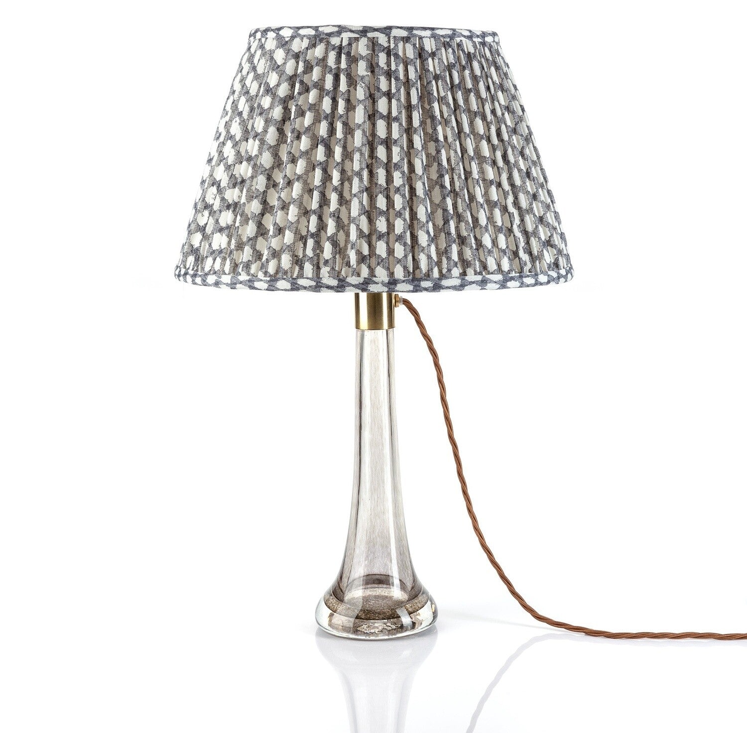 Fermoie Grey Wicker empire lampshade styled on a glass table lamp in Nashville, Tennessee