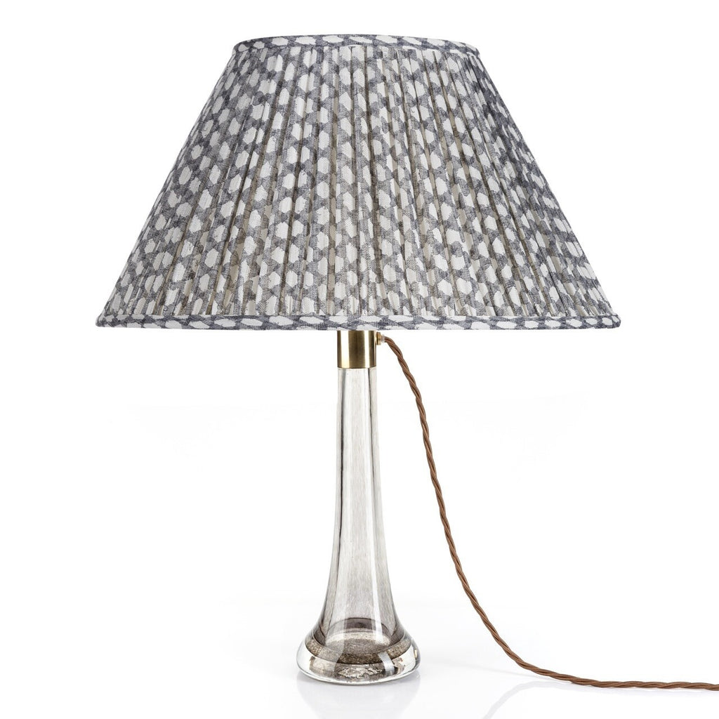 Fermoie Grey Wicker oval lampshade styled on a lucite table lamp in Nashville, Tennessee