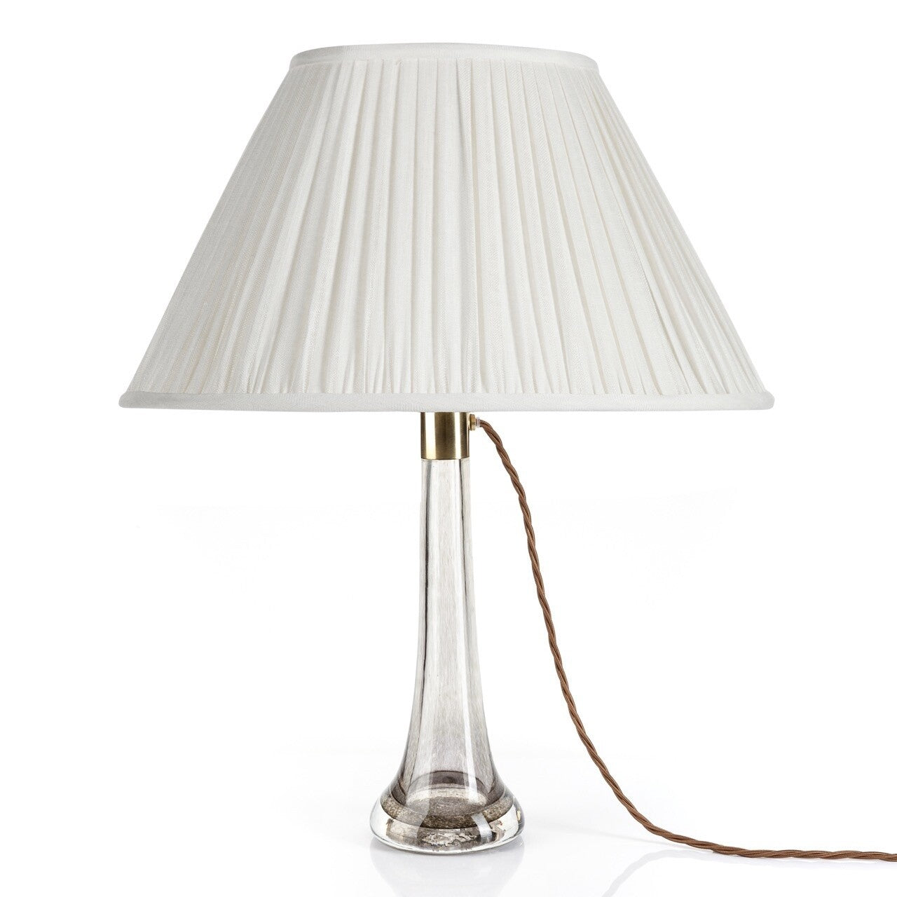 Fermoie Ivory Linen oval lampshade styled on a glass table lamp in Nashville, Tennessee