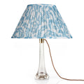 Fermoie Light Blue Marlborough oval lampshade styled on a glass table lamp in Nashville, Tennessee