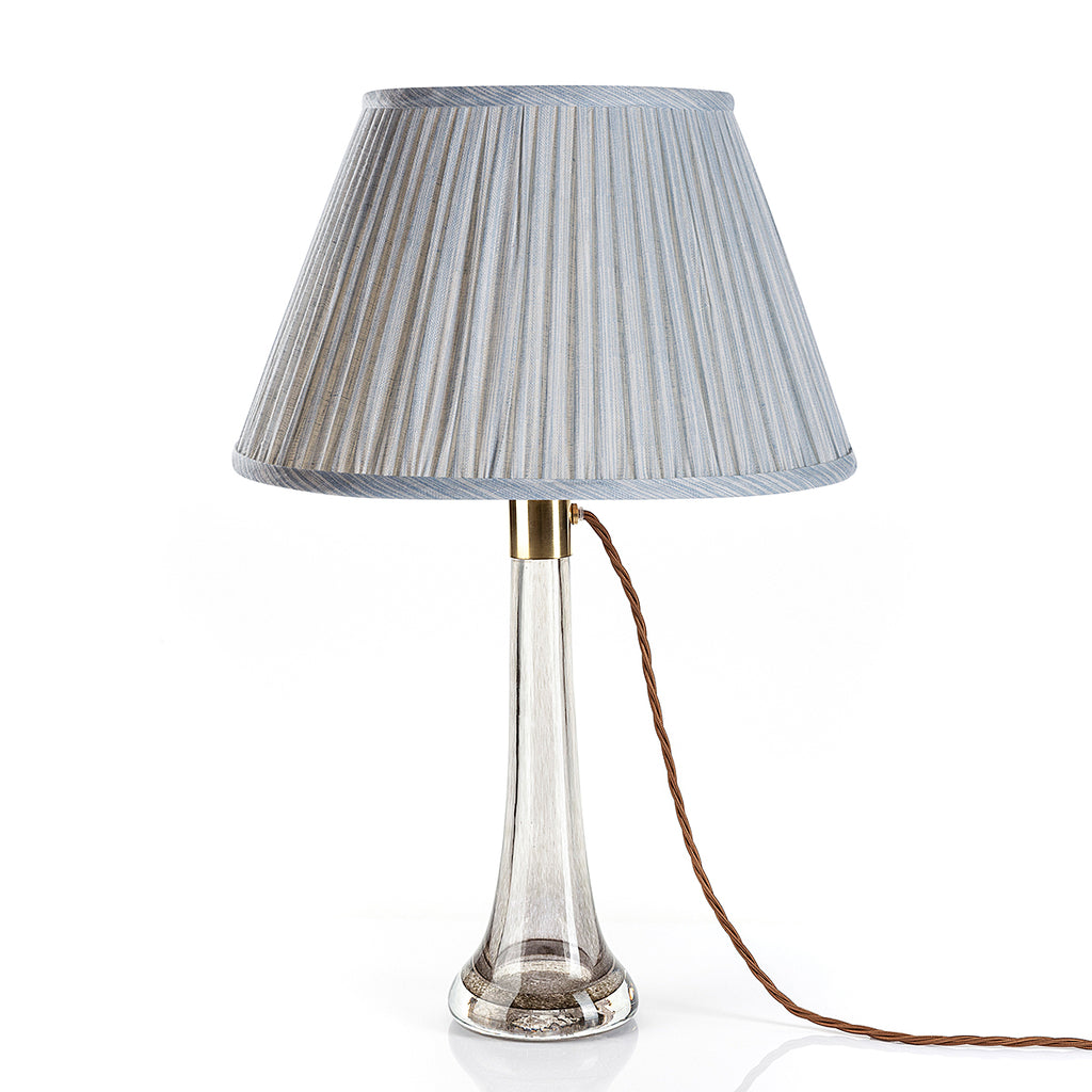 Fermoie Light Blue Strié Empire lampshade styled on a glass table lamp in Nashville, Tennessee