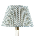 Fermoie Light Blue Wicker empire lampshade styled on a glass table lamp in Nashville, Tennessee