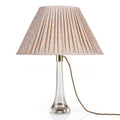 Fermoie Light Pink Rabanna oval lampshade styled on a glass table lamp in Nashville, Tennessee