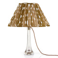 Fermoie Neutral Whittle oval lampshade styled on a lucite table lamp in Nashville, Tennessee