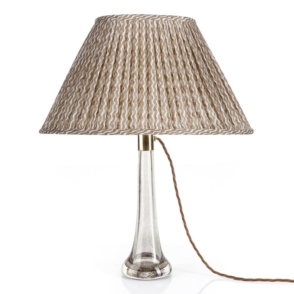 Fermoie Nut Brown Popple oval lampshade styled on a glass table lamp in Nashville, Tennessee