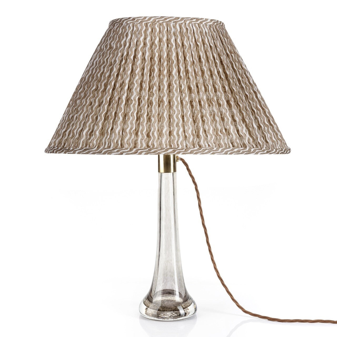 Fermoie Nut Brown Popple oval lampshade styled on a glass table lamp in Nashville, Tennessee