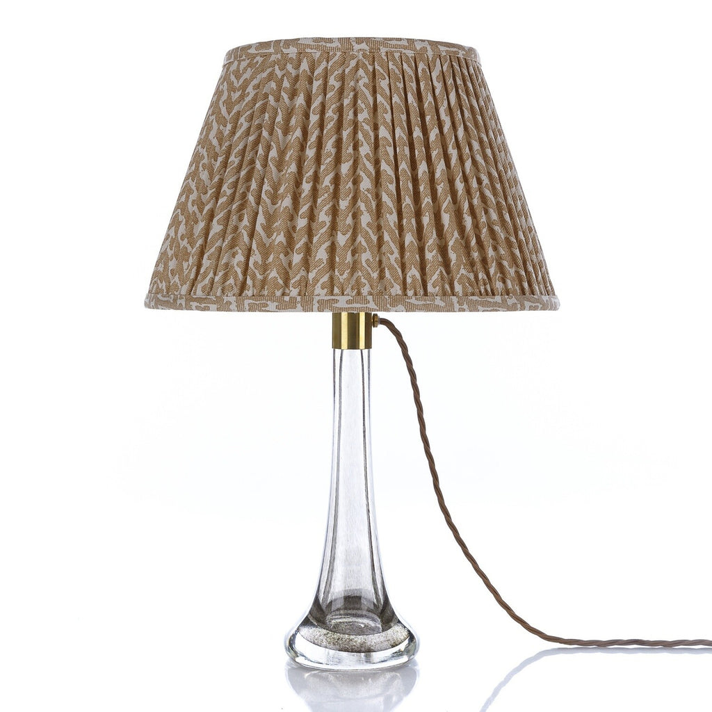 Fermoie Nut Brown Rabanna Lampshade styled on a glass table lamp in Nashville, Tennessee