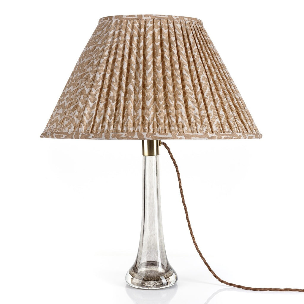 Fermoie Nut Brown Rabanna Oval Lampshade styled on a glass table lamp in Nashville, Tennessee