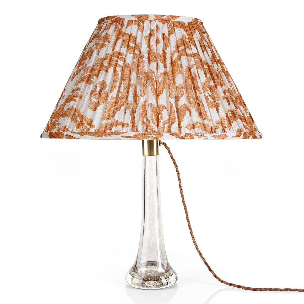 Fermoie Orange Marlborough oval lampshade styled on a glass table lamp in Nashville, Tennessee