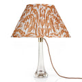Fermoie Orange Marlborough oval lampshade styled on a glass table lamp in Nashville, Tennessee