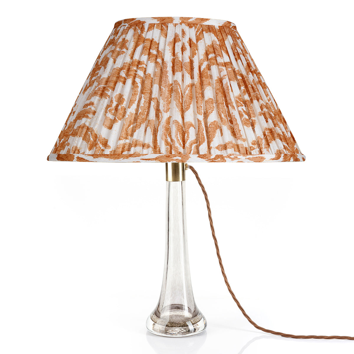 Fermoie Orange Marlborough oval lampshade styled on a glass table lamp in Nashville, Tennessee