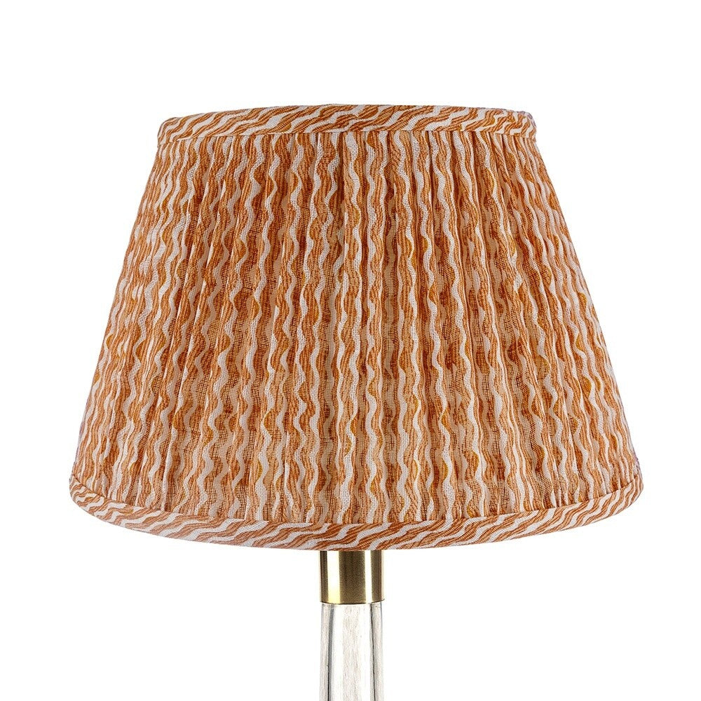 Fermoie Orange Popple empire lampshade styled on a glass table lamp in Nashville, Tennessee