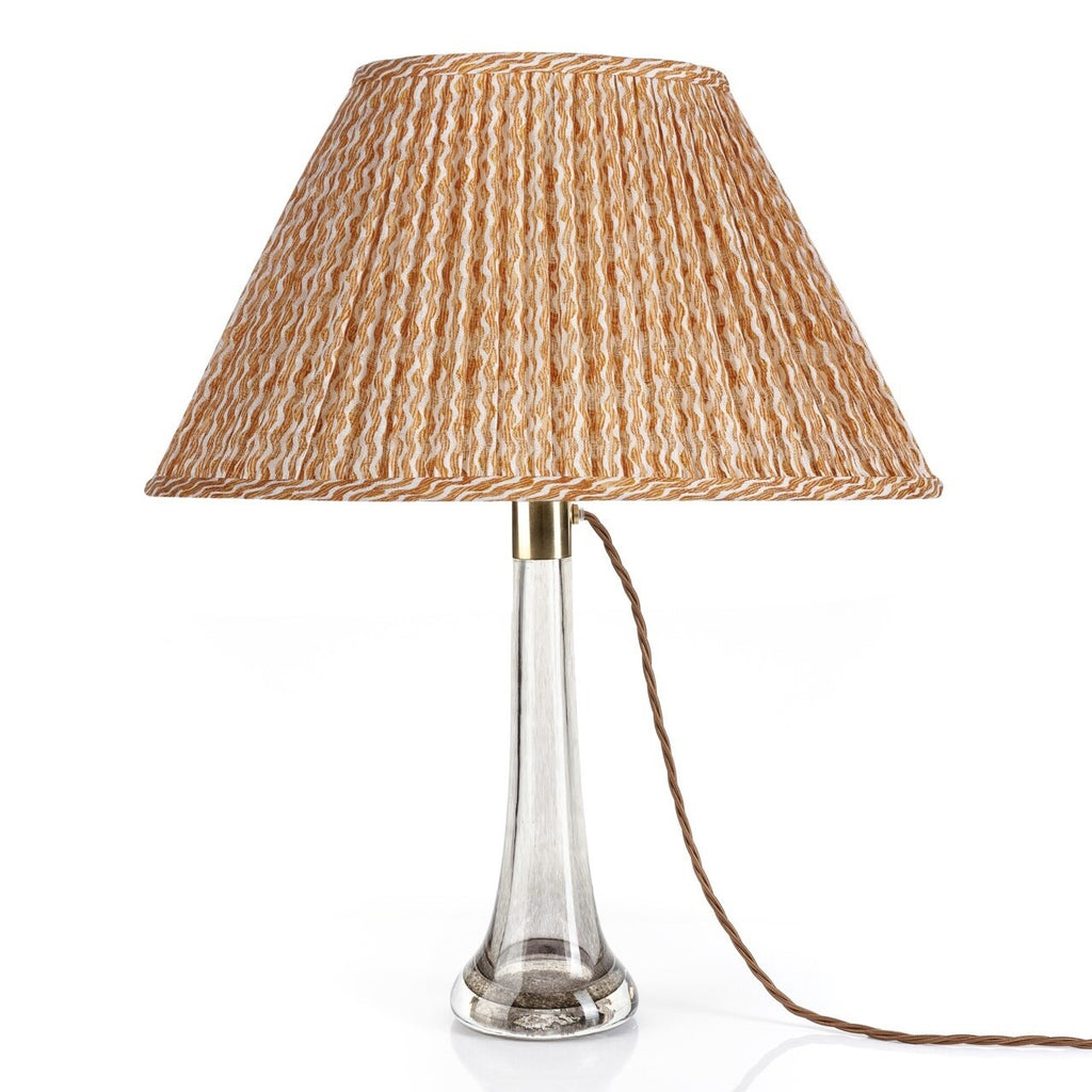 Fermoie Orange Popple oval lampshade styled on a glass table lamp in Nashville, Tennessee