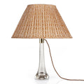Fermoie Orange Popple oval lampshade styled on a glass table lamp in Nashville, Tennessee