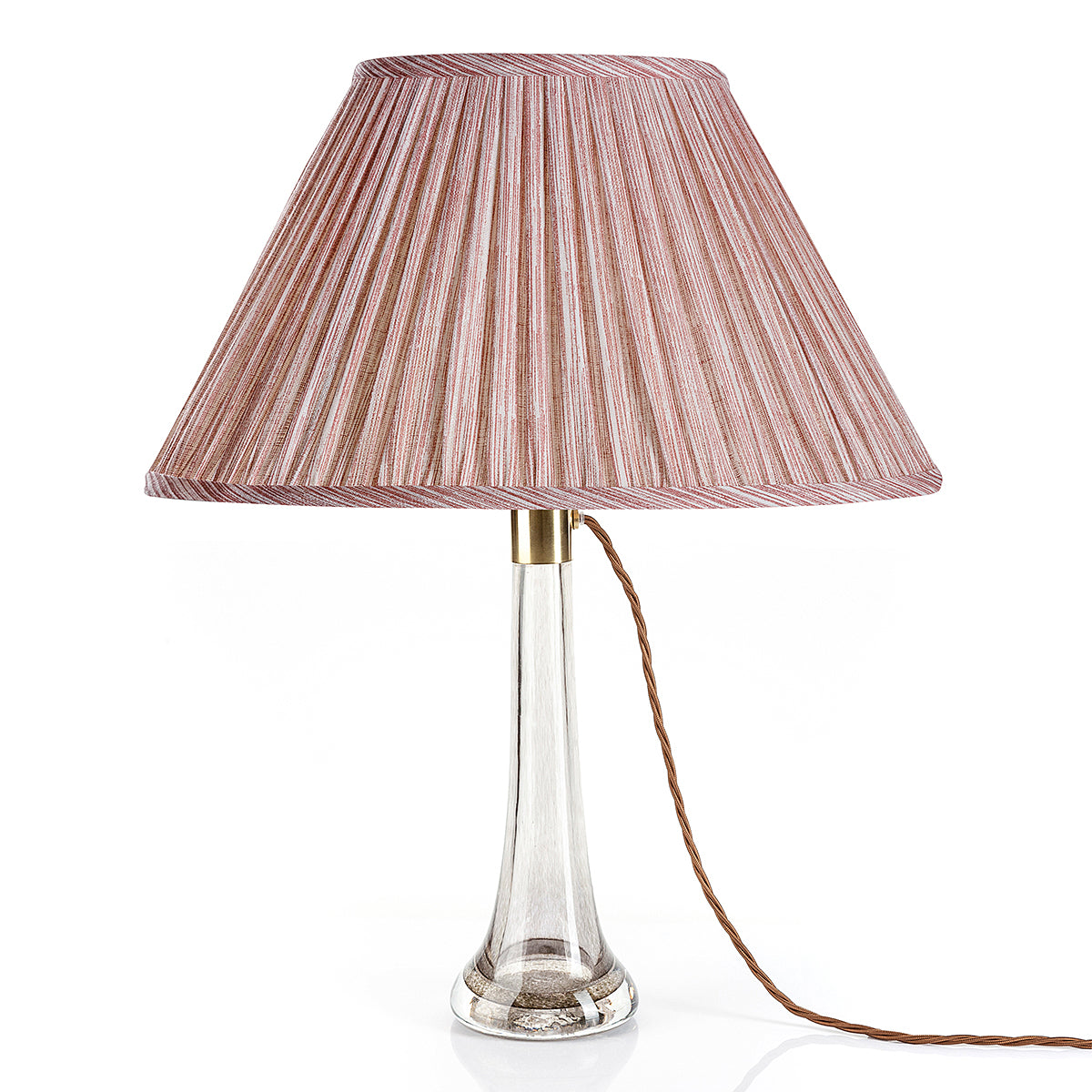 Fermoie Pink Strié oval lampshade styled on a glass table lamp in Nashville, Tennessee