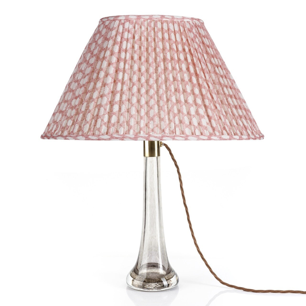 Fermoie Pink Wicker oval lampshade styled on a glass table lamp in Nashville, Tennessee