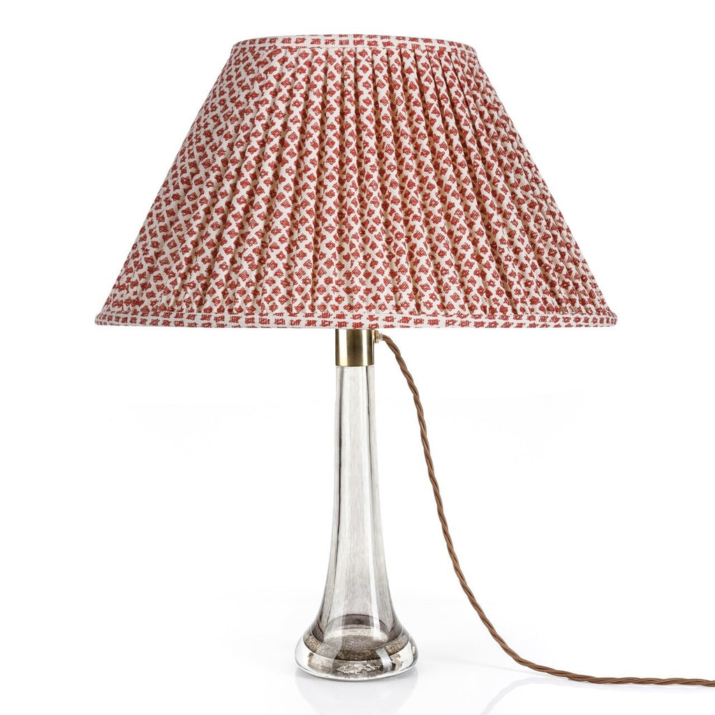 Fermoie Red Marden Oval lampshade styled on a glass table lamp in Nashville, Tennessee