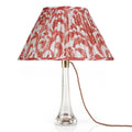 Fermoie Red Marlborough oval lampshade styled on a glass table lamp in Nashville, Tennessee